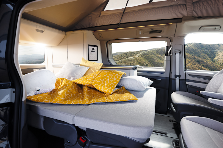 The seating area can be converted to seating for mealtimes and the rear seats transform into a bed.