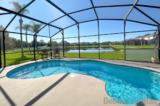 Stunning lake view from the south-facing pool deck of this Kissimmee vacation villa