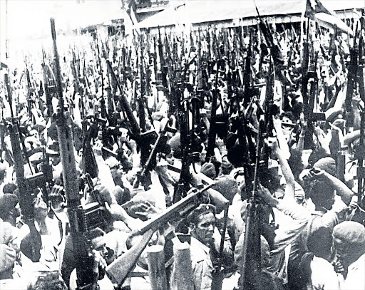 CUBAN PRESIDENT FIDEL CASTRO (balcony) triumphant after repulsing the invaders