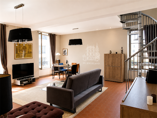 Living dining room with spiral staircase in this luxury apartment / penthouse for sale in Versailles ($1,000,472 - 124 m²)