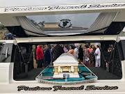 The small white coffin bearing the body of Sadia Sukhraj at the Christian Revival Centre in Chatsworth on May 29, 2018.