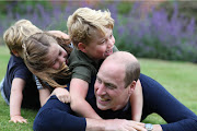 The Duke of Cambridge plays on the grass with (right to left) Prince George, Princess Charlotte and Prince Louis to mark both his birthday and Father's Day. Prince William and his wife have posted adorable images of Prince George to mark his seventh birthday.