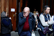 A man reacts while leaving a mass by the Bishop of Bilbao, Joseba Segura and priest Josu Lopez Villalba, a victim of sexual abuse, where forgiveness was asked for from victims of sexual abuse by the Catholic Church, in Bilbao, Spain, March 24, 2023. 