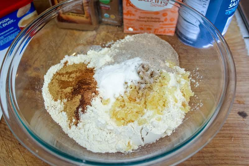 Flour And Spices Added To A Mixing Bowl.