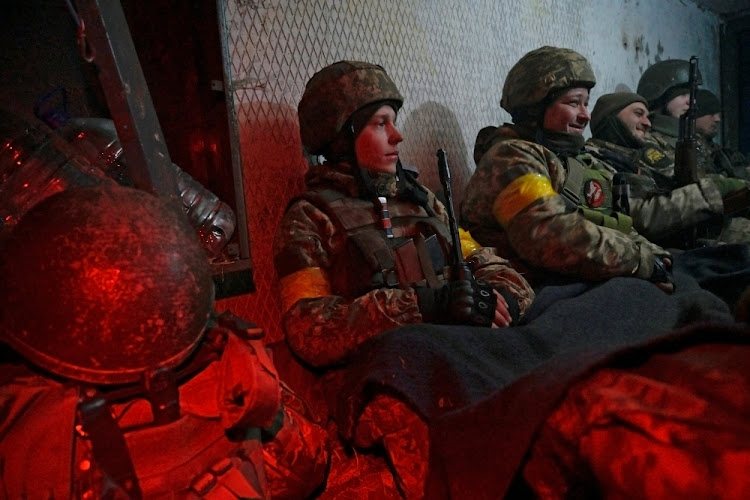 Ukrainian servicemen take cover in a shelter at fighting positions at the military airbase Vasylkiv in the Kyiv region, Ukraine on February 26 2022.