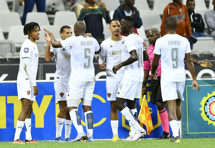 Devin Titus of Stellenbosch FC celebrate after scoring a goal during the DStv Premiership match against Cape Town City FC at DHL Cape Town Stadium on Tuesday. (Inset) Stellenbosch coach Steve Barker.