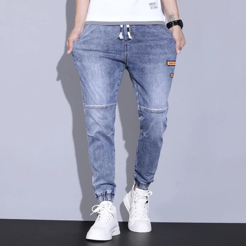 Elastische taillebroek met trekkoord, stiksels en label, biedt comfort en casual stijl voor dagelijks gebruik, perfect voor een relaxte look.