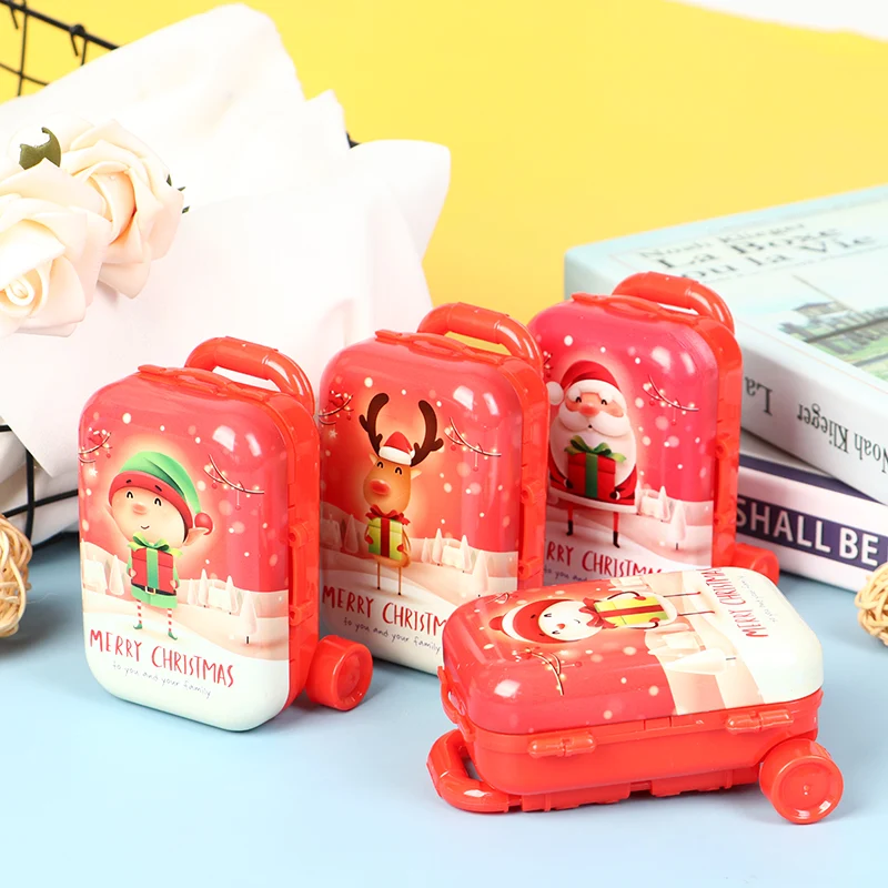 Porte-monnaie de Noël en forme de valise trolley en fer blanc. Parfait pour ranger pièces et petits objets, idéal comme cadeau de Noël.
