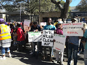 Earthlife Africa representatives protesting outside the New Development Bank offices in Sandton calling for the development of renewable energy resources and the prevention of climate change on July 25 2018