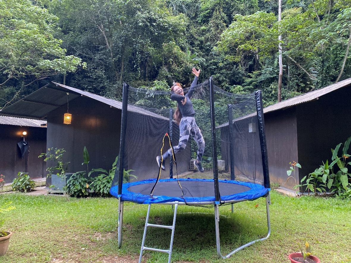 A person on a trampoline

Description automatically generated with medium confidence