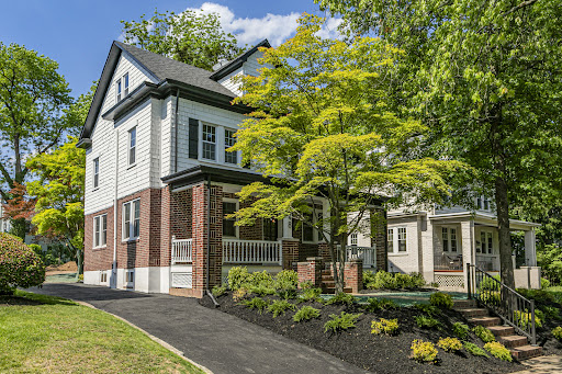 Buy this luxury property in Princeton (United States) - White and brick house with green garden