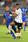 Orlando Pirates'  Vincent Pule and Nazeer Allie of Maritzburg United during their PSL  match at Orlando Stdaium  last night. 