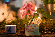 A note is seen in a makeshift memorial during a candlelight vigil for travel blogger Gabby Petito, whose body was discovered in a remote corner of the Bridger-Teton National Forest after travelling with her boyfriend, in Blue Point, New York, US, September 24, 2021. 