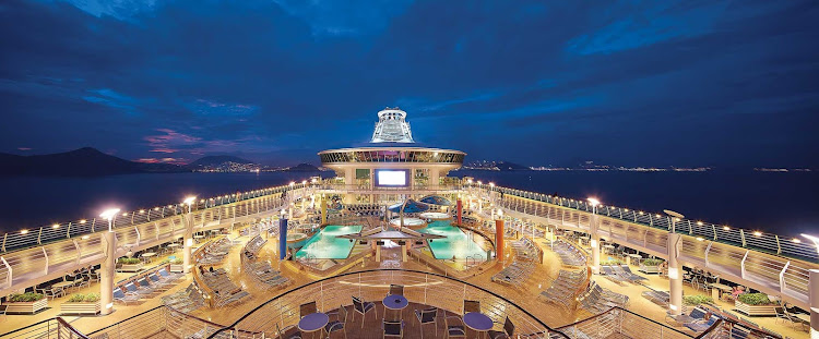 Step onto the main deck at night for a cool sea breeze on Mariner of the Seas. 