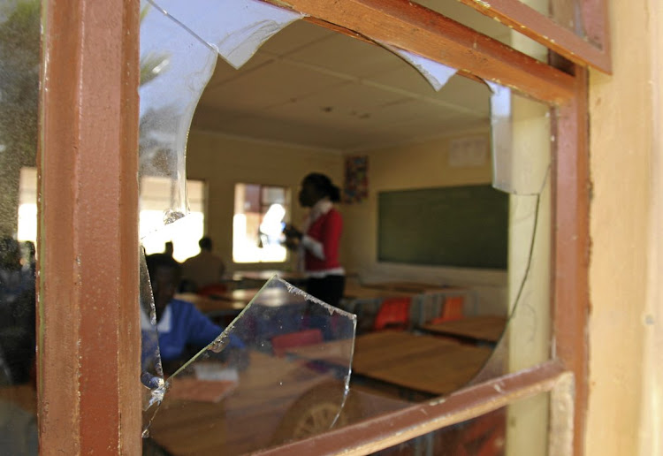 SCHOOL OF HARD KNOCKS: 'Nobody really cares about the children of the poor as long as their own children are taken care of.' Looking into a classroom at Nkululeko High School, in Kwanobuhle, Eastern Cape Picture: EDREA CLOETE/MEDIA 24