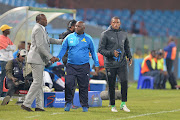 Mamelodi Sundowns head coach (C) Pitso Mosimane shakes a hand with his Ajax Cape Town counterpart Stanley Menzo after the Absa Premiership match at Loftus Versfeld Stadium on April 25, 2017 in Pretoria, South Africa.