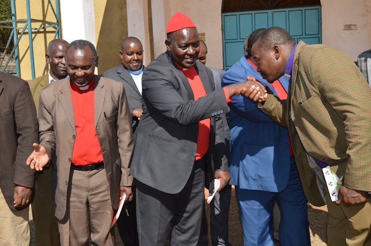 Bishop David Njuguna (in red cap), the chairman of the AIPCA church clergy in the country, with Kiambu county church leaders on Tuesday