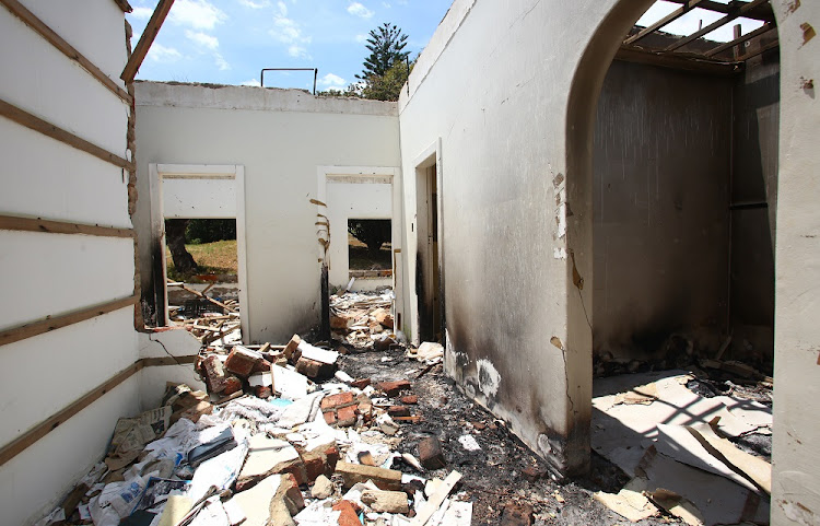 This burnt out farmhouse in Mooinooi stands at the centre of a murder trial that has divided a farming community right down the middle and exposed deep-seated racial faultlines.