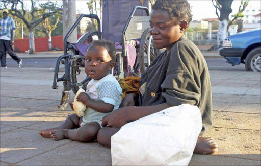 Mother with child begging. File photo.