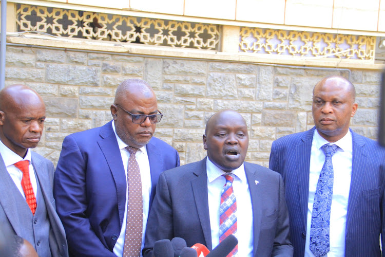 Nandi senator Samson Cherargei flanked by his colleagues during a press conference at Parliament buildings