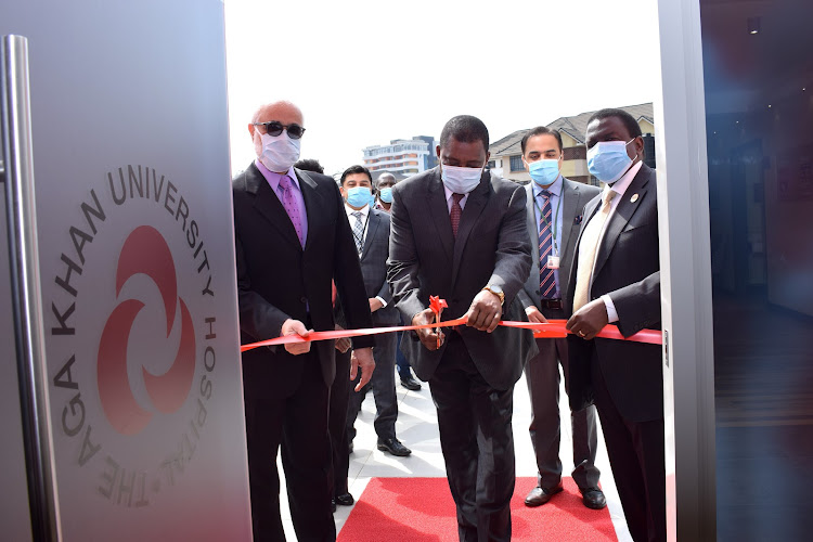 National Assembly Speaker Justin Muturi (centre) cuts the ribbon to officially open the Peponi Specialty and Executive Clinic by Aga Khan University Hospital in Westlands, Nairobi, on July 21, 2020