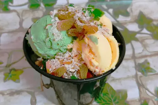 Fruit Salad Topped With Dry Fruits And Premium Ice Cream