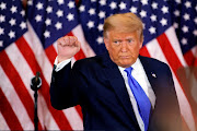 US President Donald Trump raises his fist as he reacts to early results from the 2020 US presidential election in the East Room of the White House in Washington, US on November 4 2020. 