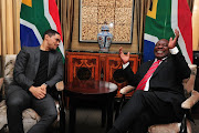 Trevor Noah attended parliament as a special guest of President Cyril Ramaphosa on Thursday. South Africans can look forward to some laughs at the expense of the president, who challenged the popular comedian 'to make fun of me' while he's visiting his home country. 