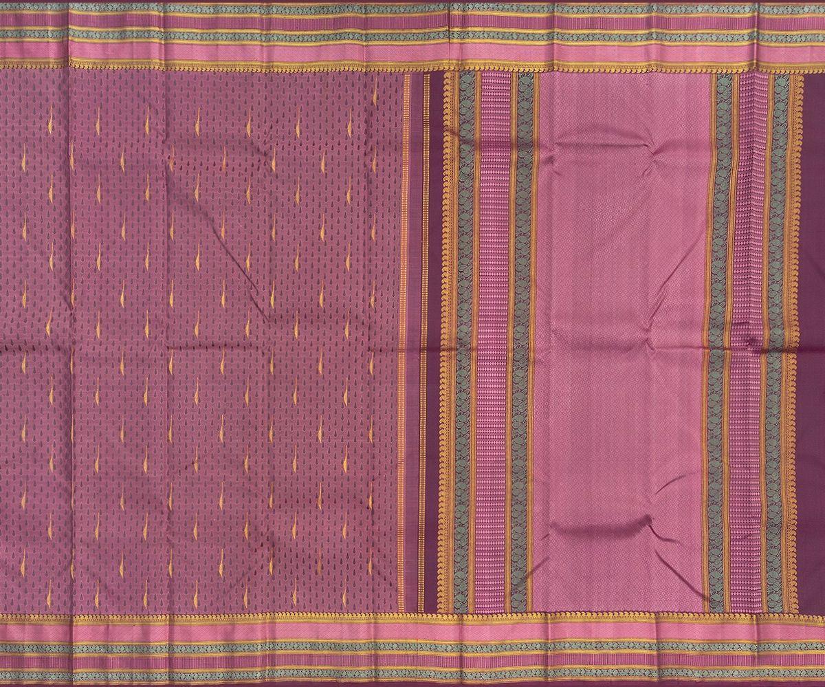 The thilagam motif forms a recurring pattern on the body of this handloom Kanchipuram silk saree that’s been naturally dyed using lac (araku). 