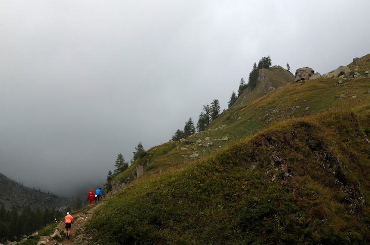 Competitors climb the Val Ferret during the 16th Ultra-Trail du Mont-Blanc (UTMB) race near Courmayeur, Italy September 1, 2018.