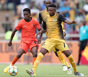 Polokwane City midfielder Kabelo Mahlasela (L) vies for the ball with Black Leopards midfielder Xolani Ndlovu (R) during the Limpopo derby at Old Peter Mokaba Stadium in Polokwane on March 1 2020.    