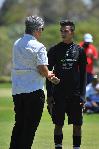 Ari Efstathiou (CEO) chats with Sameehg Doutie during the Ajax Cape Town training session. File photo