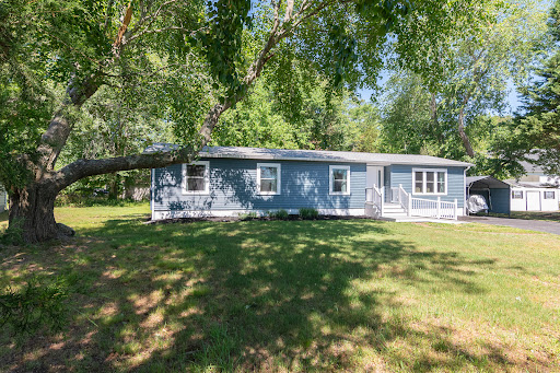 Buy this luxury house in Ocean View (United States) - Blue house with tree-filled yard