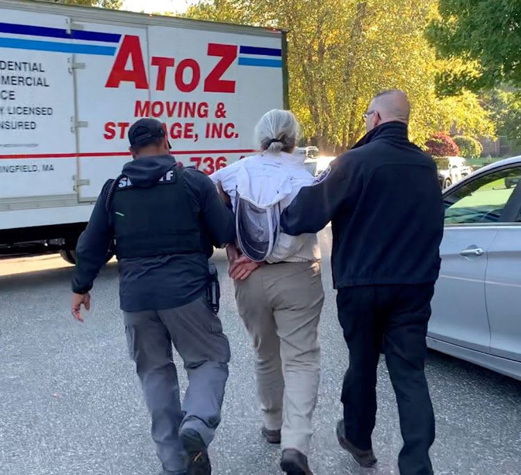 Rorie Sussan Woods, 55, is detained after unleashing a swarm of bees on deputies serving eviction papers in Longmeadow, Massachusetts, US, October 12, 2022. Hampden County Sheriff’s Office/Handout via REUTERS THIS IMAGE HAS BEEN SUPPLIED BY A THIRD PARTY