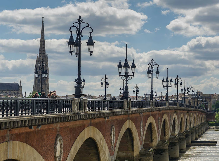 Stroll the Pont de Pierre in Bordeaux, France, on your next Ponant cruise.