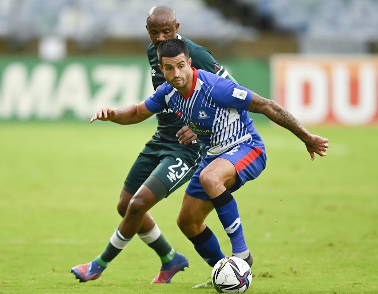 Keegan Richie of Maritzburg United is challenged by Xola Mlambo of AmaZulu during the DStv Premiership match at Moses Mabhida Stadium in Durban on Saturday.