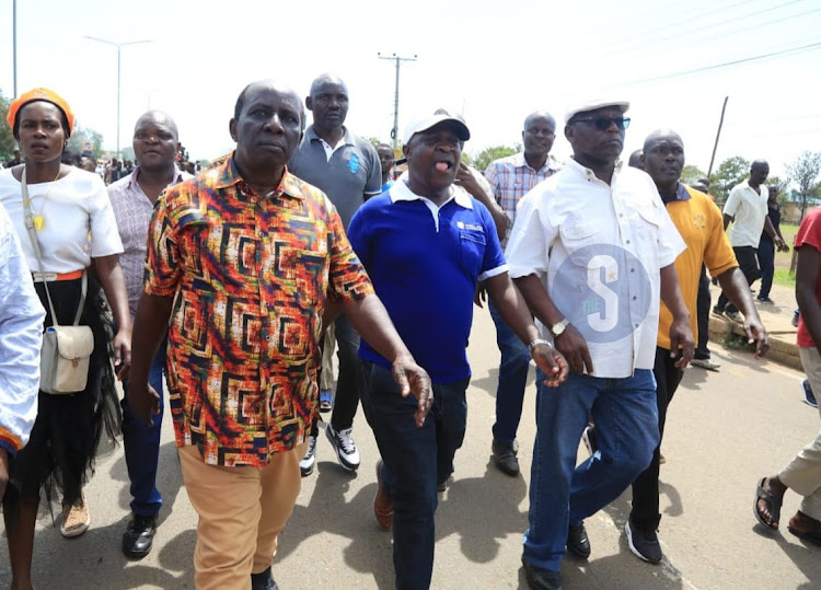 Seme MP James Nyikal, Kisumu Deputy Governor Mathew Owili and South East Nyakach ward MCA Lumumba Owade while leading the protest at Patels in Kisumu on March 30, 2023.