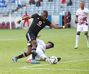 Tshegofatso Mabasa of Orlando Pirates tackled by Junaid Sait of Swallows FC during the DStv Premiership match between Orlando Pirates and Swallows FC at Chatsworth Stadium on September 11, 2021 in Johannesburg.