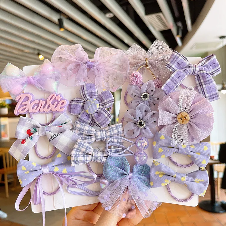 Anneau de cheveux élastique pour bébé avec fleur et nœud en maille. Accessoire adorable et pratique pour les coiffures des petites filles.