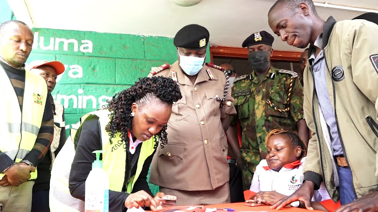 Eastern regional commissioner Evans Achoki and Eastern police commander oversee a boda boda registration exercise at Embu Huduma centre on Monday, March 28.