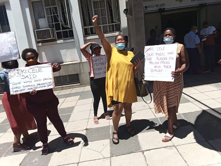 Spouses of Cape Town police officers living in safe houses protest outside the Western Cape police headquarters on Thursday against what they described as exorbitant rental increases.