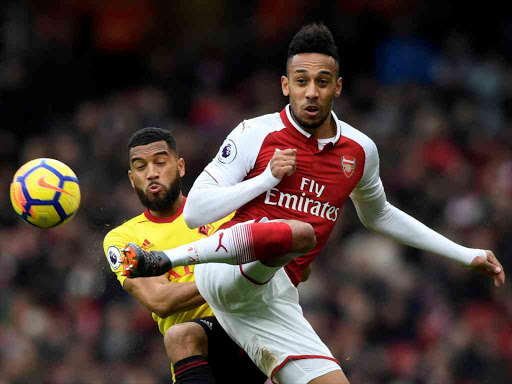 Arsenal's Pierre-Emerick Aubameyang in action with Watford's Adrian Mariappa during a Premier League match at Emirates Stadium