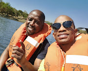 Abel Tau, left, and the SAHRC's Buang Jones during an inspection of water quality at Roodeplaat Dam.