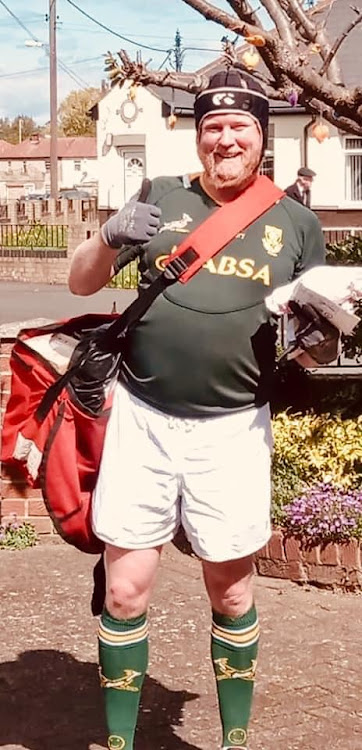 British postman Jon Matson dressed as a Springbok rugby player for his rounds on Monday