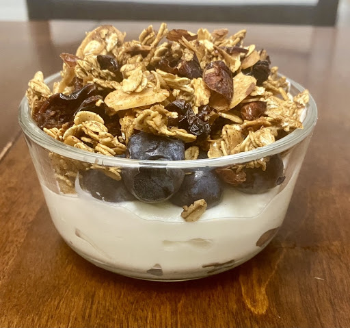 Picture shown coconut vanilla Greek yogurt with blueberries and topped off with granola