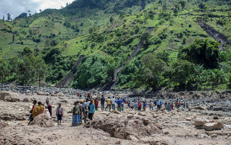 Congolese civilians gather after rains that destroyed buildings in Nyamukubi village in the South Kivu province of the Democratic Republic of Congo, in this May 6 2023 file photo. Picture: REUTERS