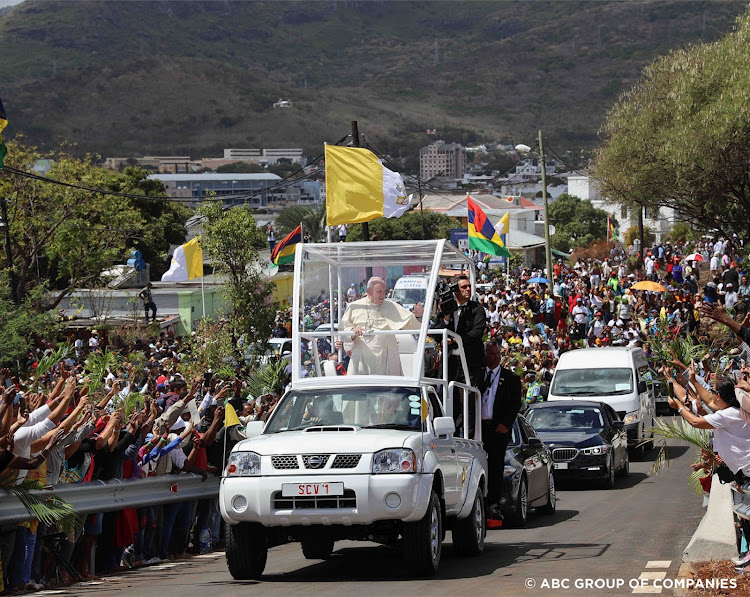 Pope Francis greets crowds on a visit to Mauritius in Nissan NP300 Popemobile. Picture: Supplied