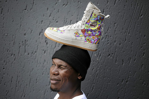 If the shoe fits ... Thabiso Hadebe of Black Faff, a sneaker customising company, poses in the firm's studio in Tembisa, near Midrand, Gauteng. The company is taking advantage of the booming sneaker culture and creating unique, colourful designs for its clients.