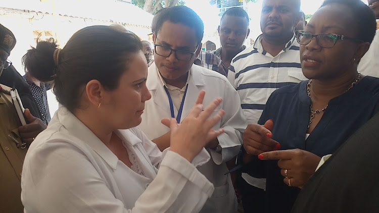 Orthopedic surgeon Dr Liliana Casos speaks to the then Health Cabinet Secretary Sicily Kariuki last year.