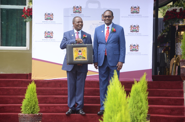 Treasury CS Njuguna Ndung'u and PS Chris Kiptoo outside Treasury building, Nairobi, on June 15, 2023.